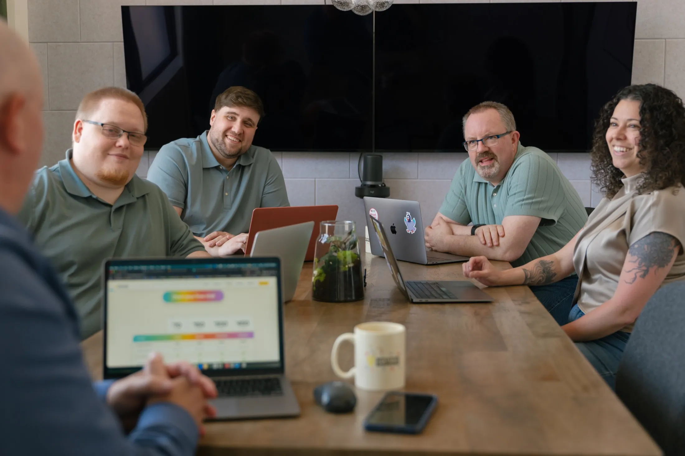 The Intuitive Shipping support team collaborating around a conference table